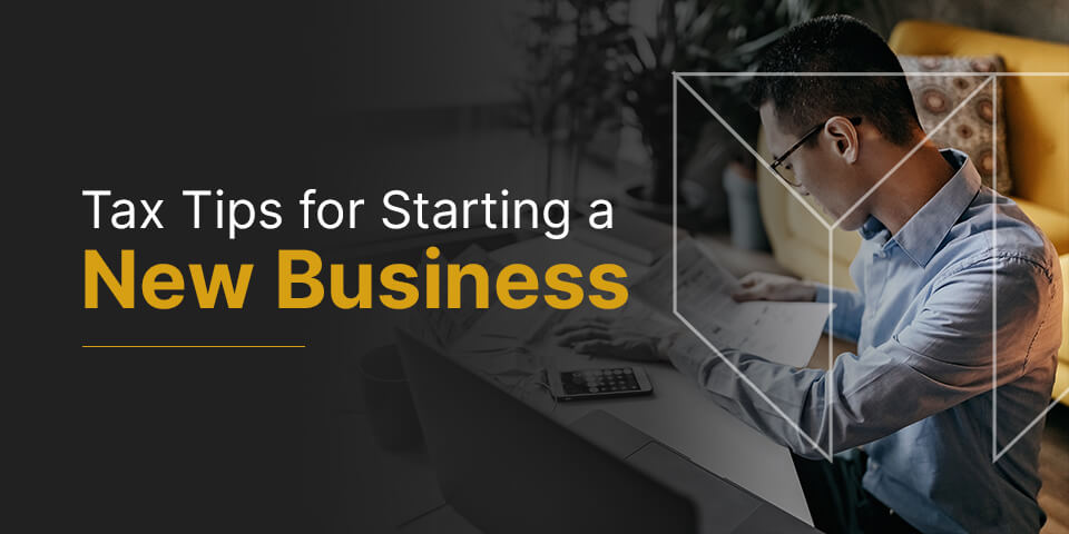 a man sitting at a desk with the words tax tips for starting a new business below him