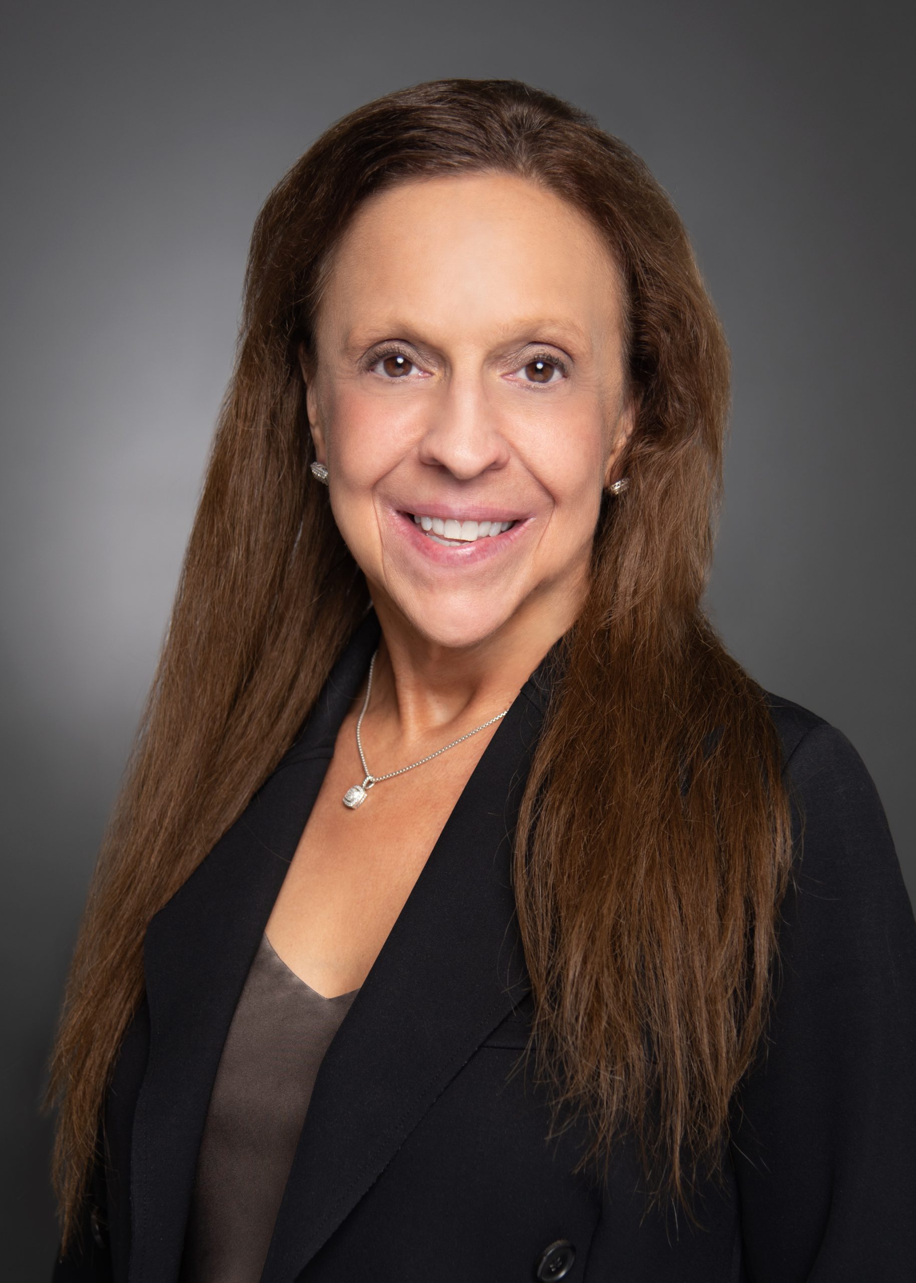 professional headshot of Susan Hopkins, CPA wearing a pearl necklace and blazer
